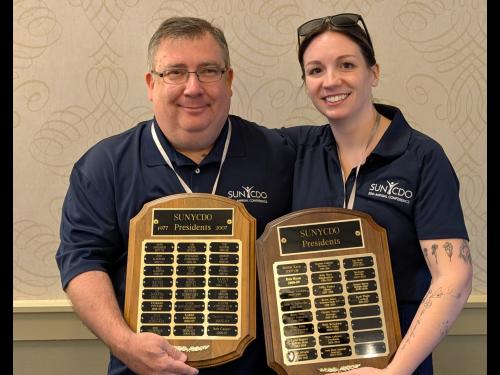 SUNY Oswego's Tina Phillips, left, and Chris Grow from Fredonia were past presidents of the SUNY Career Development Organizations and co-chairs of its 50th-anniversary event in early June 2026