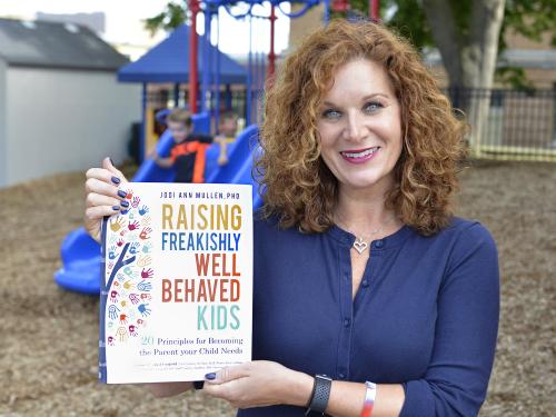 Jodi Mullen with her book, Raising Freakishly Well Behaved Kids: 20 Principles for Becoming the Parent Your Child Needs