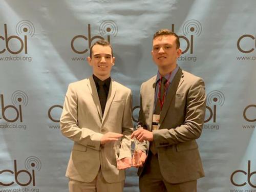 WNYO representatives Mark Rowlands and Ben Grimaudo accept first-place CBI award for Best Sports Play-By-Play