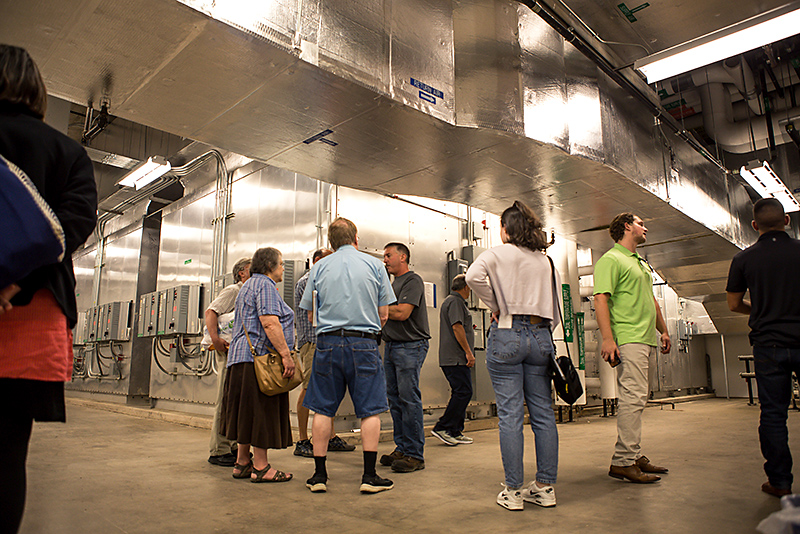 Richard Shoen  talks about the geothermal facilities of the Shineman Center while leading a tour in the mechanical room in the environmentally friendly building’s basement