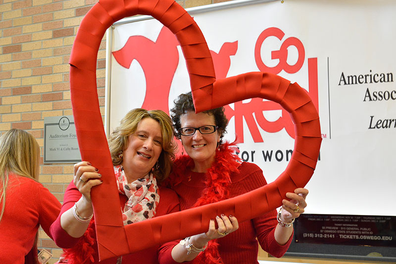 Staff members posing with heart