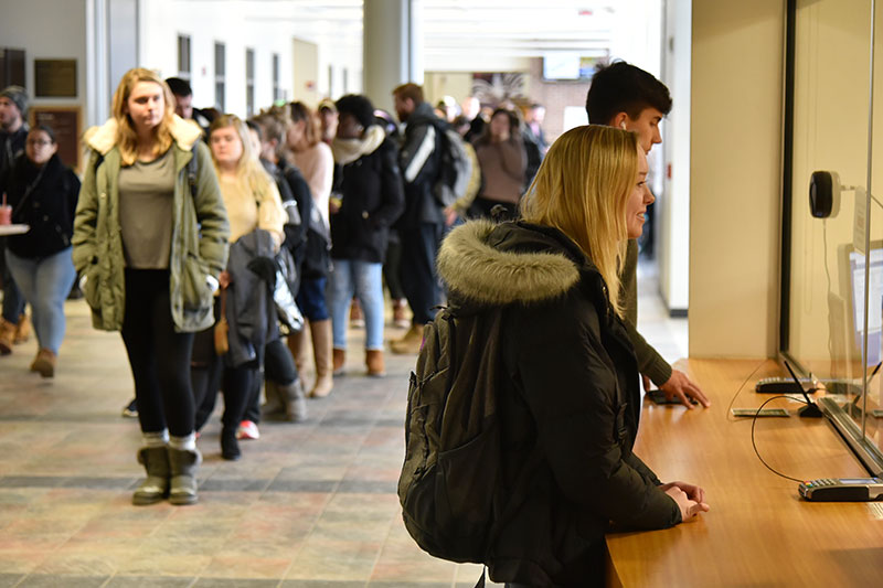 Students buying Whiteout Weekend tickets