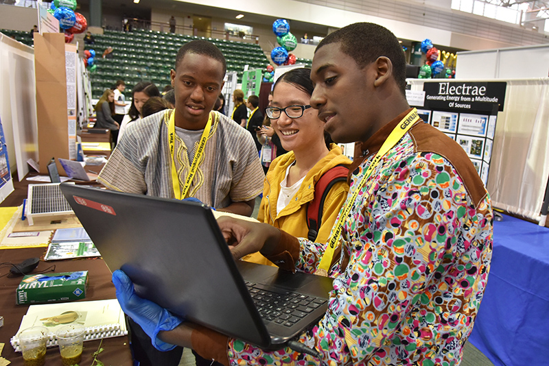 Students from Angola explain their project Super Paper at the GENIUS Olympiad