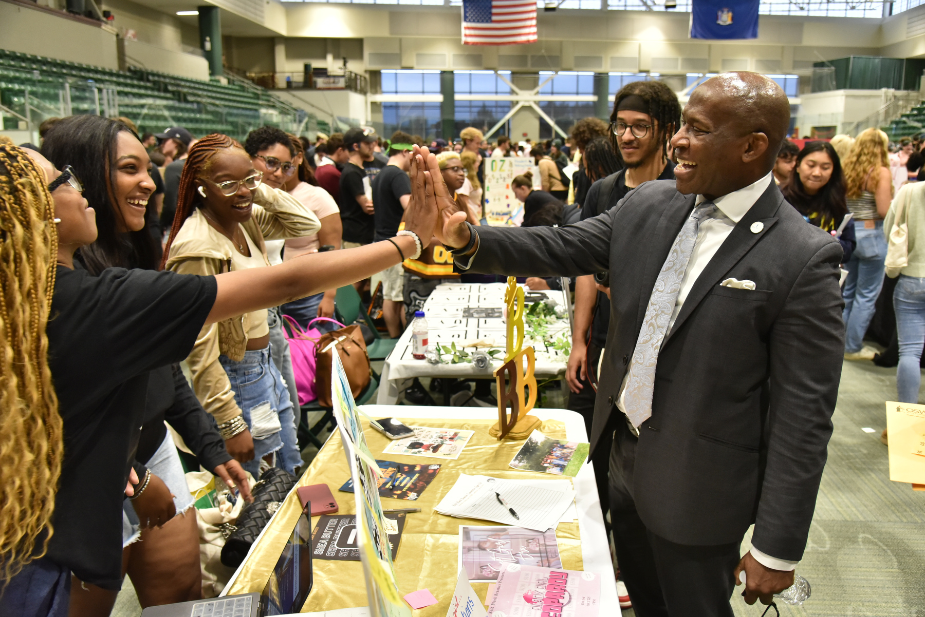 The fall 2024 Student Involvement Fair featuring many of SUNY Oswego's 150+ clubs and organizations was held Aug. 28 in the Deborah F. Stanley Arena and Convocation Hall, Marano Campus Center. President Peter O. Nwosu joined the event showcasing these opportunities to meet club members such as (pictured) the Bold Black Beauties.