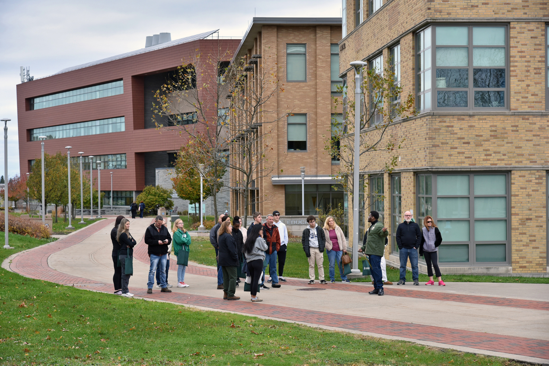 The Fall Open House on Nov. 11 offered campus tours; a vibrant information fair with campus partners, academic departments, student clubs and organizations; as well as presentations on admissions, financial aid and student life. Aiden Wilson, pictured, Student Association president and admissions tour guide, conducts a tour for a group outside Wilber and Park Halls.