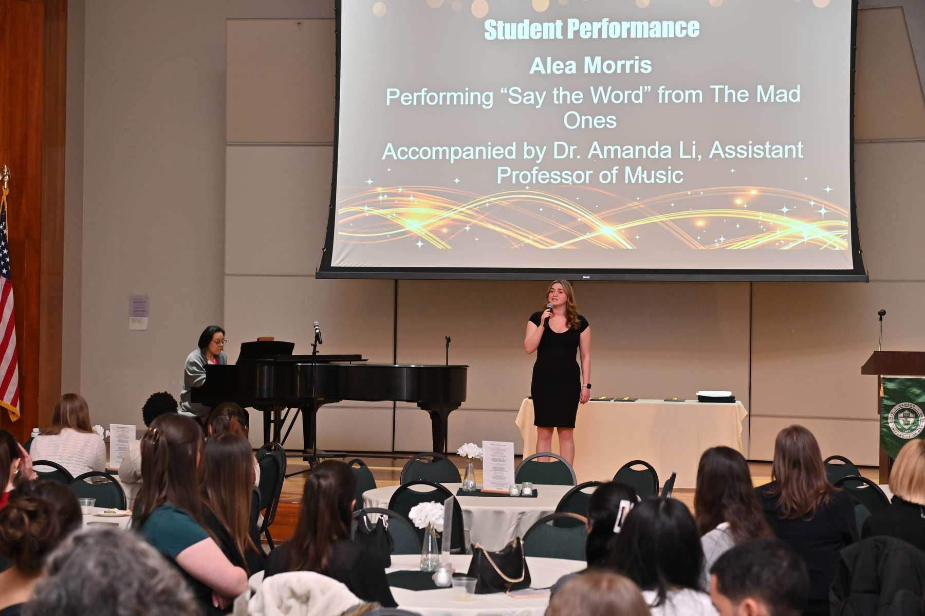 The Student Leadership Ceremony organized by the Divisions of Academic and Student Affairs recognizes student leaders as well as the achievements of SUNY Oswego's clubs and organizations. Student Alea Morris, one such honoree, sings "Say the Word" from “The Mad Ones” during the ceremony, accompanied on piano by Amanda Li, assistant professor of music.
