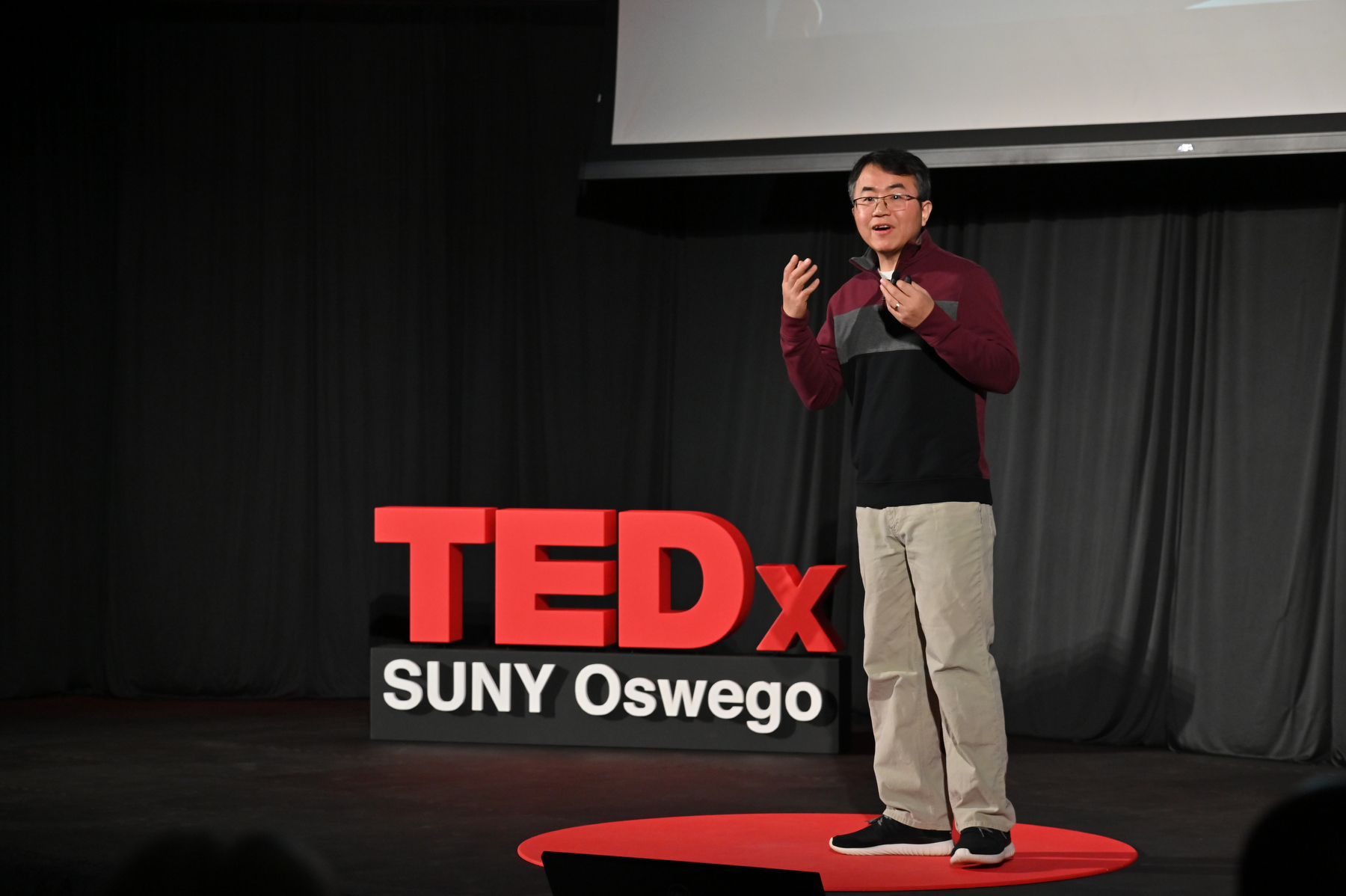 Yonggang Wang – a meteorologist, climatologist and associate professor of meteorology at SUNY Oswego – speaks during TEDxSUNY Oswego on "Chasing the Snow: Exploring the Science and Adventure of Lake Effect Snow.