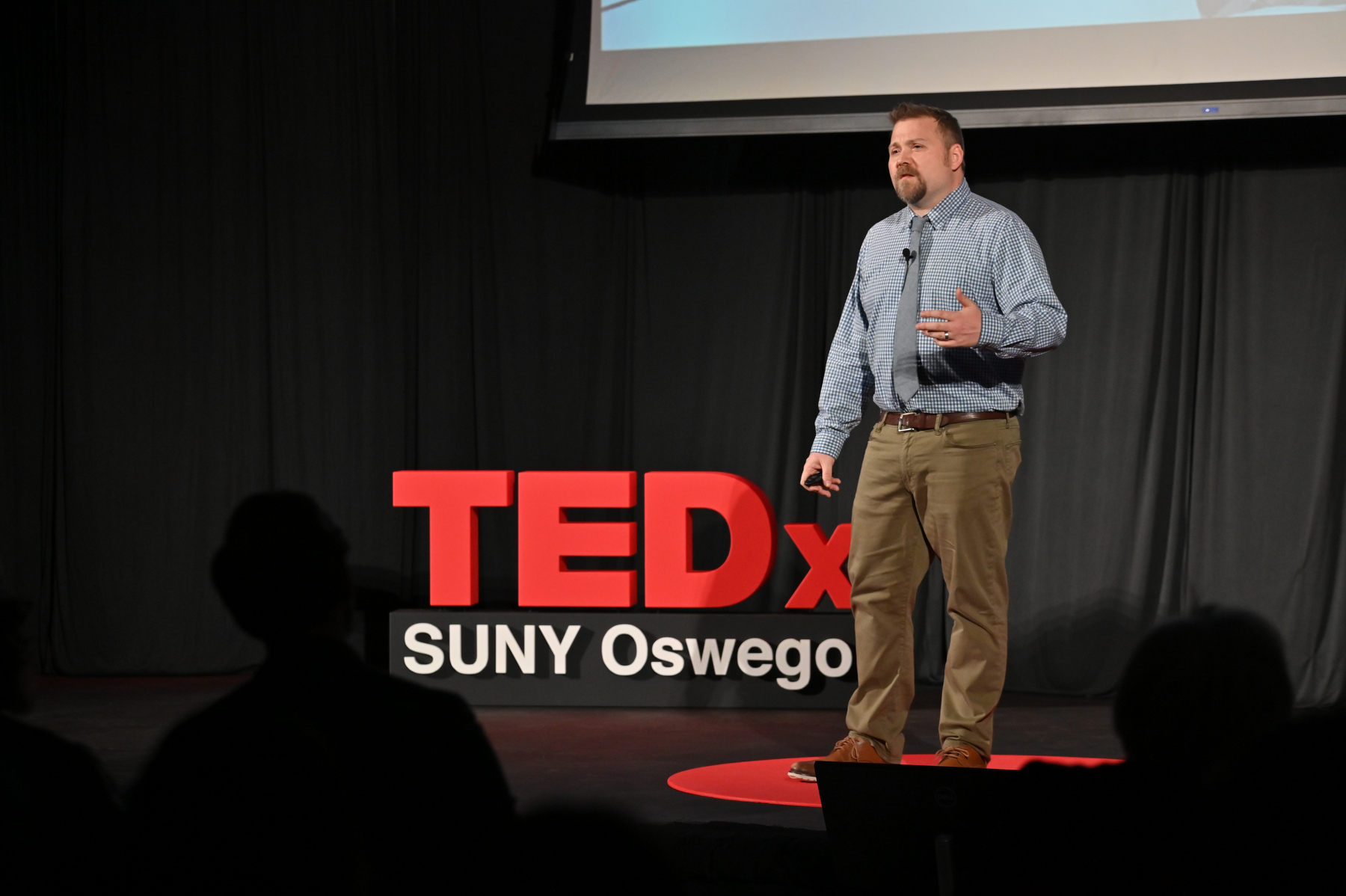 Christopher Stein – assistant professor of technology at SUNY Oswego, landscape designer, artist and two-time Oswego alumnus – speaks during TEDxSUNY Oswego on "Surviving Technology - Tools for Life."