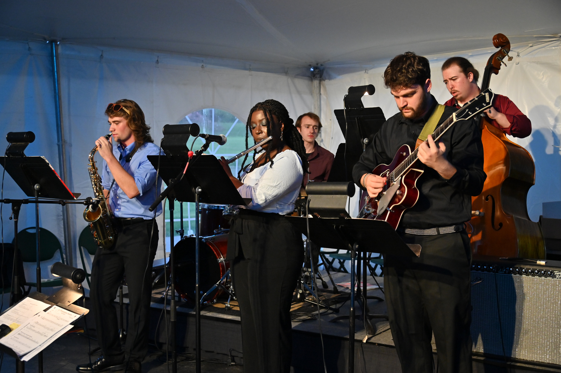 Student musicians in the university's Jazz Ensemble play during the Commencement Eve Torchlight Ceremony on May 16.