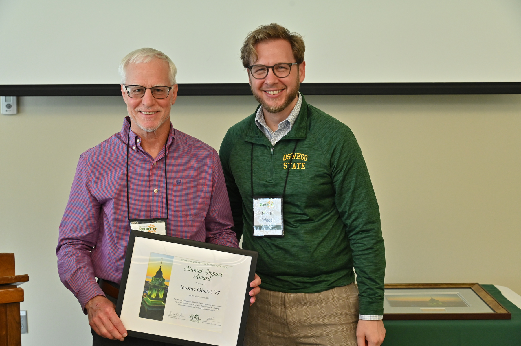 Longtime admission staff member and 1977 graduate Jerome “Jerry” Oberst received the Alumni Impact Award at the University Update program during Alumni Reunion Weekend. Presenting his award is Heath Wood, vice president for university advancement. Read more about this award and this year’s other winners.