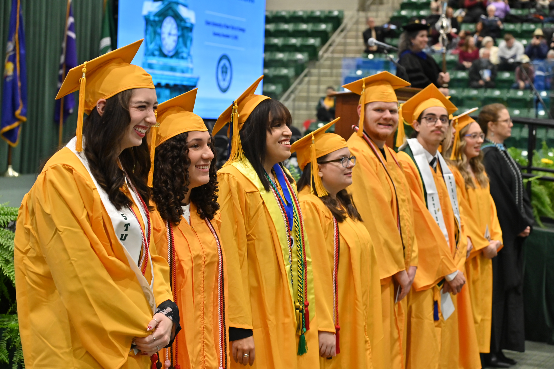 Suma cum laude candidates stand in front of the platform as the undergraduate and graduate candidates enter the convocation hall prior to the December Commencement ceremony. Summa cum laude honorees are those with 3.8 GPAs or higher as undergraduates.
