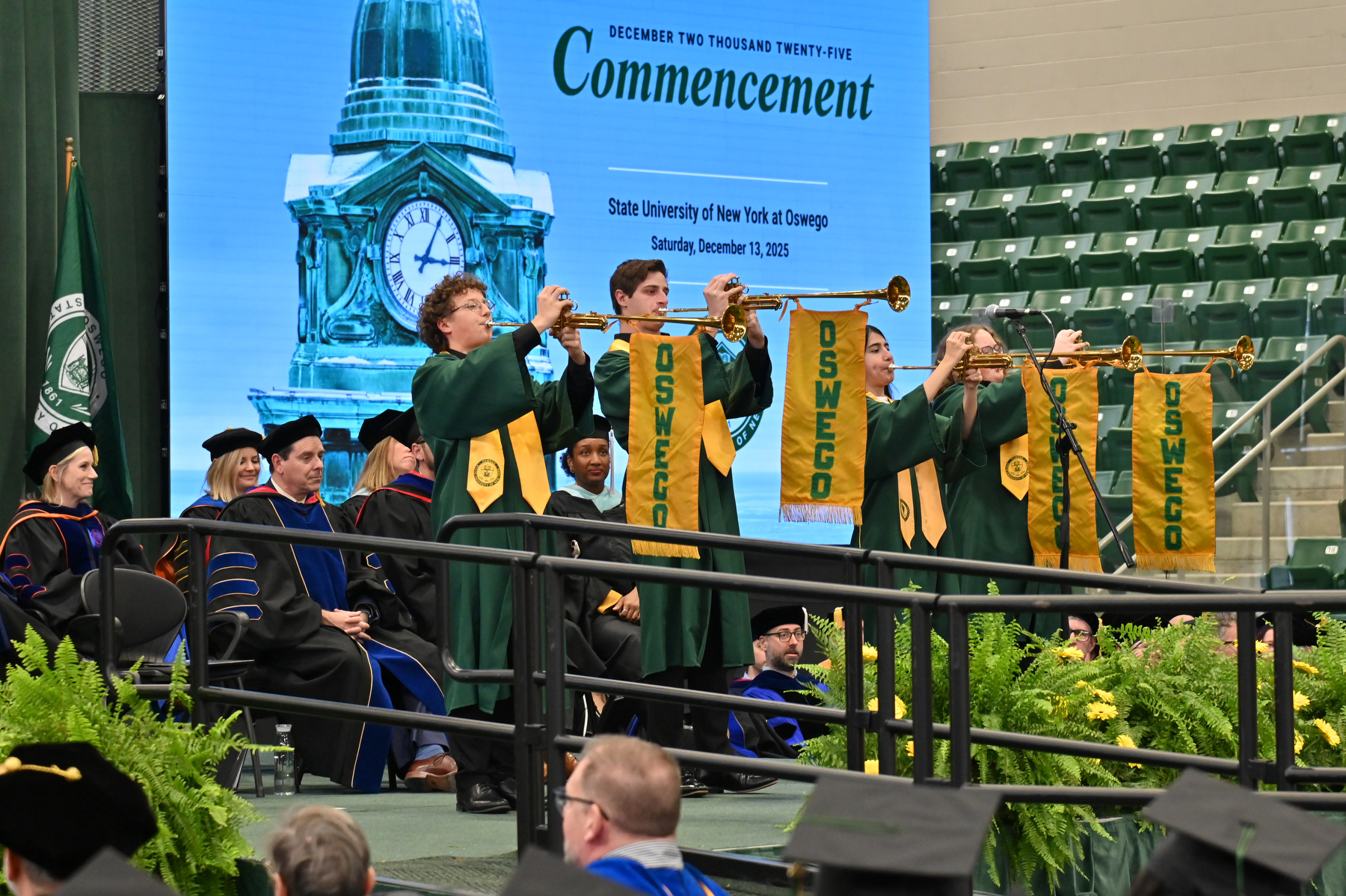 Trumpeters signal the conclusion of the Commencement Ceremony from the platform.