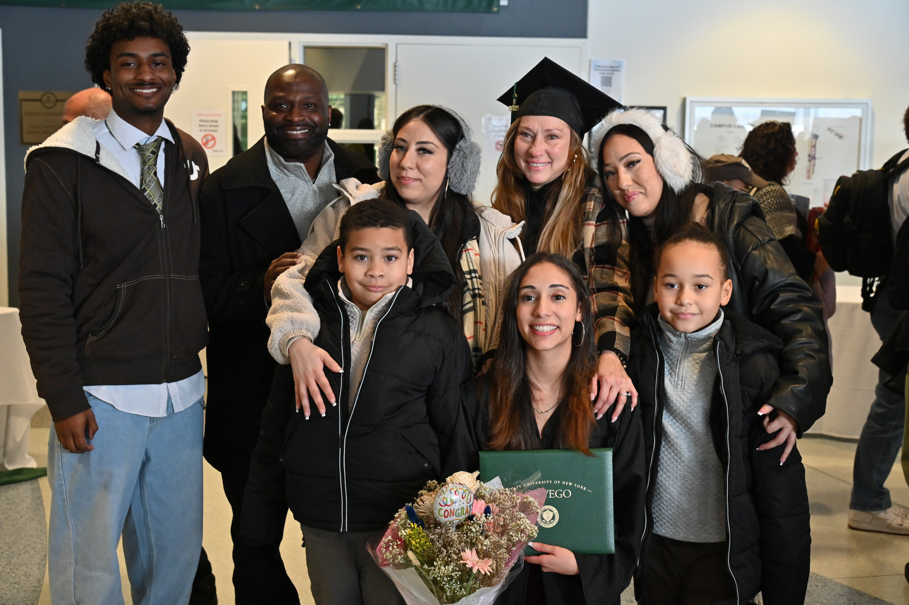 Graduate Kayla Turnquest, an accounting major and entrepreneurship minor, celebrates with family after the ceremony.