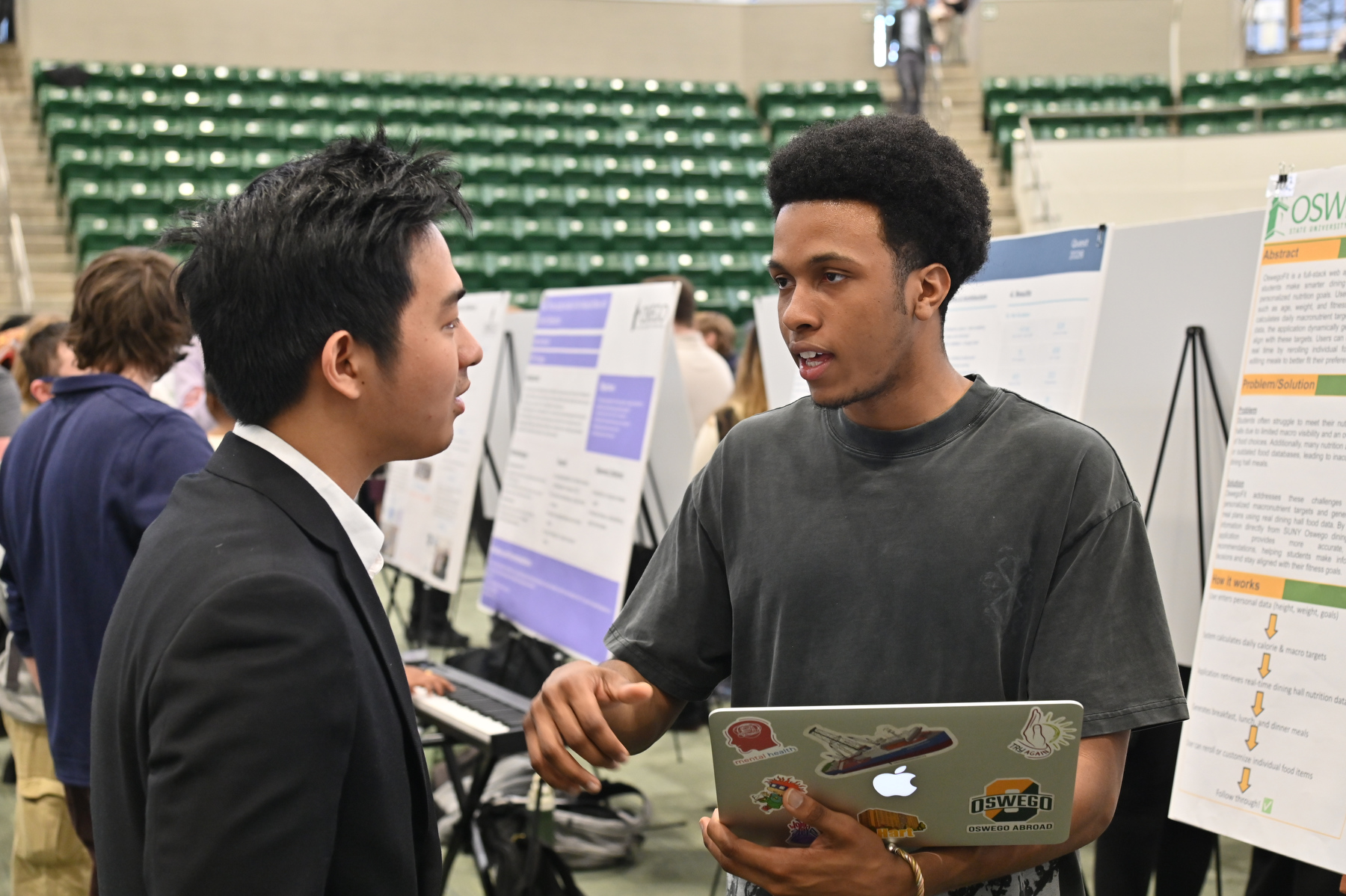 SUNY Oswego’s Quest presentations include talks, competitions, panels, debates, shows, posters, readings, recitals and demonstrations. The poster session included computer science majors Abdullie Diallo (right) and Phone Pyae Sone Phyo, shown discussing their projects.
