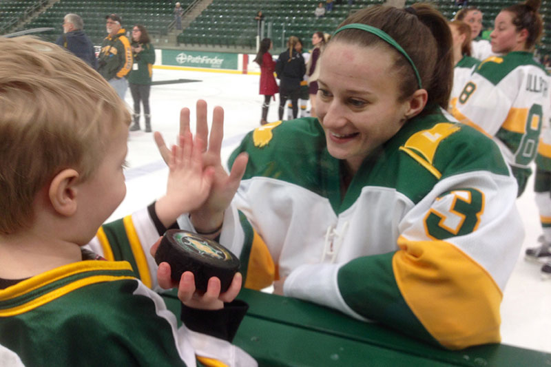 Erika Truschke greeting young fan