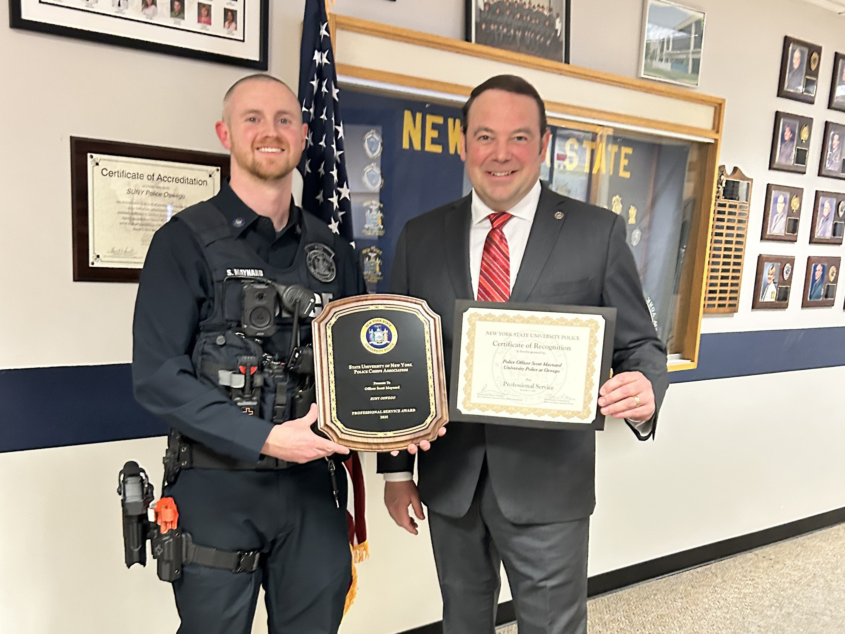 SUNY Oswego University Police Officer Scott Maynard (left) earned SUNY’s Professional Service Award, an honor that recognizes members for acts that greatly enhance the operation of their respective University Police departments.