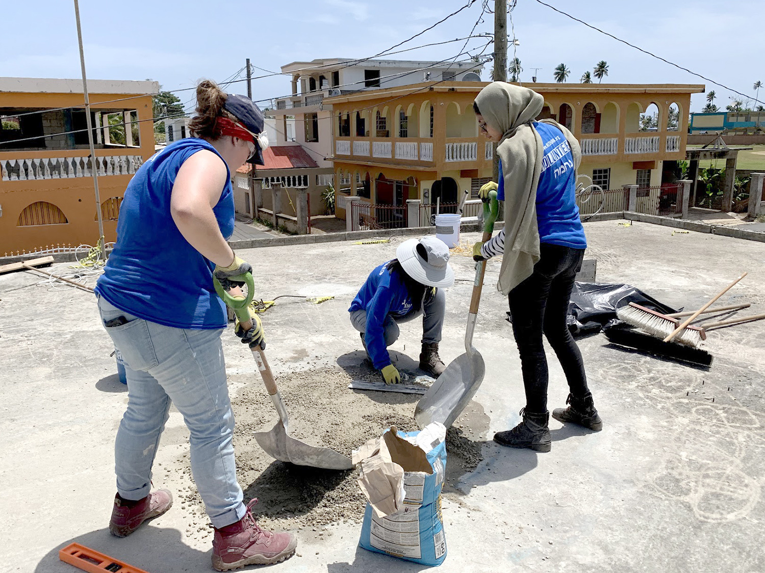 Students help patch a roof in Puerto Rico