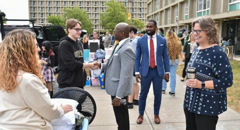 President Peter. O. Nwosu with Kathleen Kerr, vice president for student affairs, Sara Rebeor (pictured in background), assistant vice president of residence life and housing, and Jamal Coleman, director of operations for the Office of the President greet