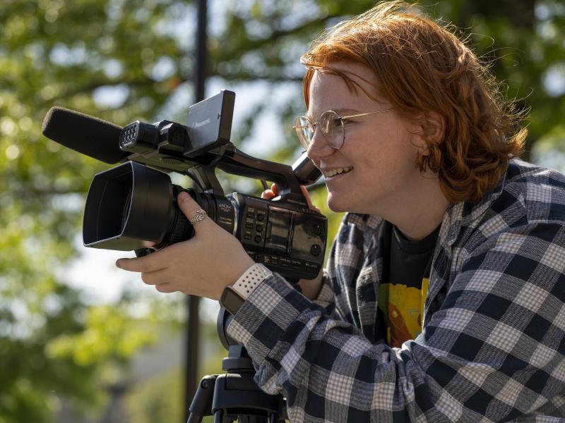 female student using a videocamera