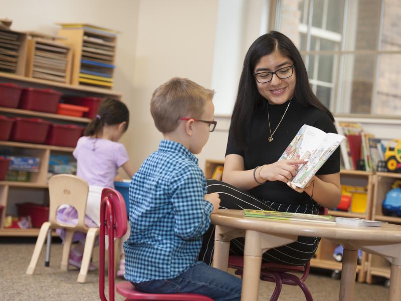 female student teacher working one on one with a student