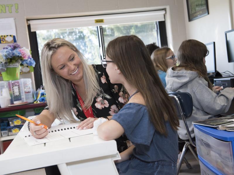 female student in a classroom student teaching