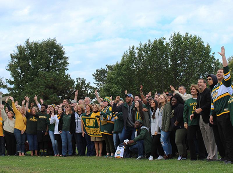 Members of the campus community gather for Green and Gold Day